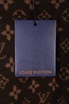 Louis Vuitton clothing tag on dark brown monogram knit fabric