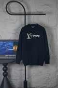 Dark long-sleeve knit sweater with rhinestone LV-style logo on chest