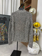 Textured zip jacket, black-and-white speckled knit, back view on hanger