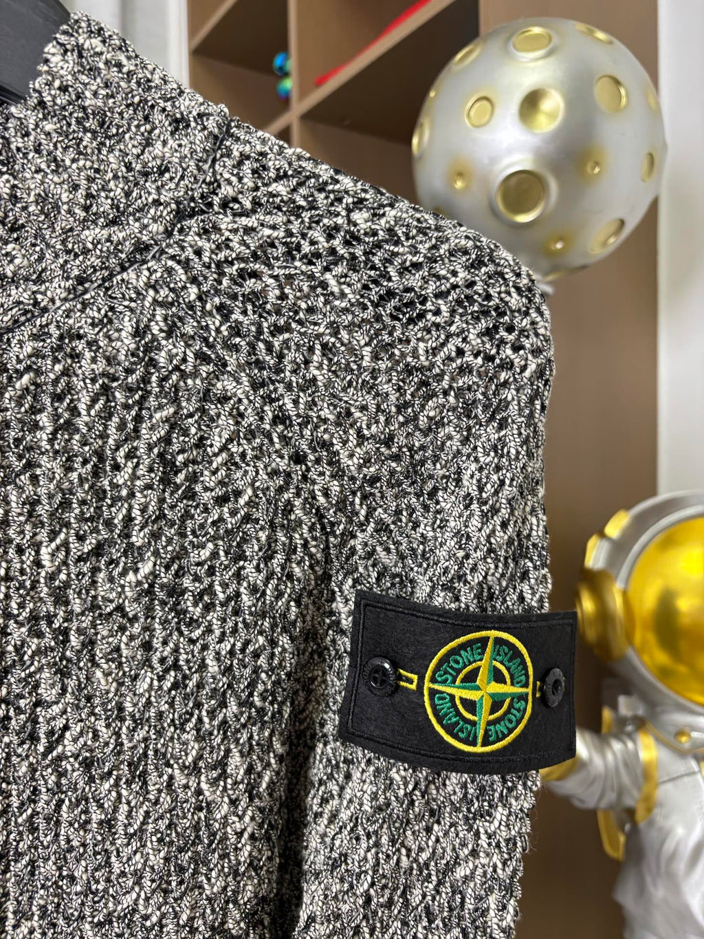 Textured zip jacket sleeve with Stone Island patch, black-and-white speckled knit