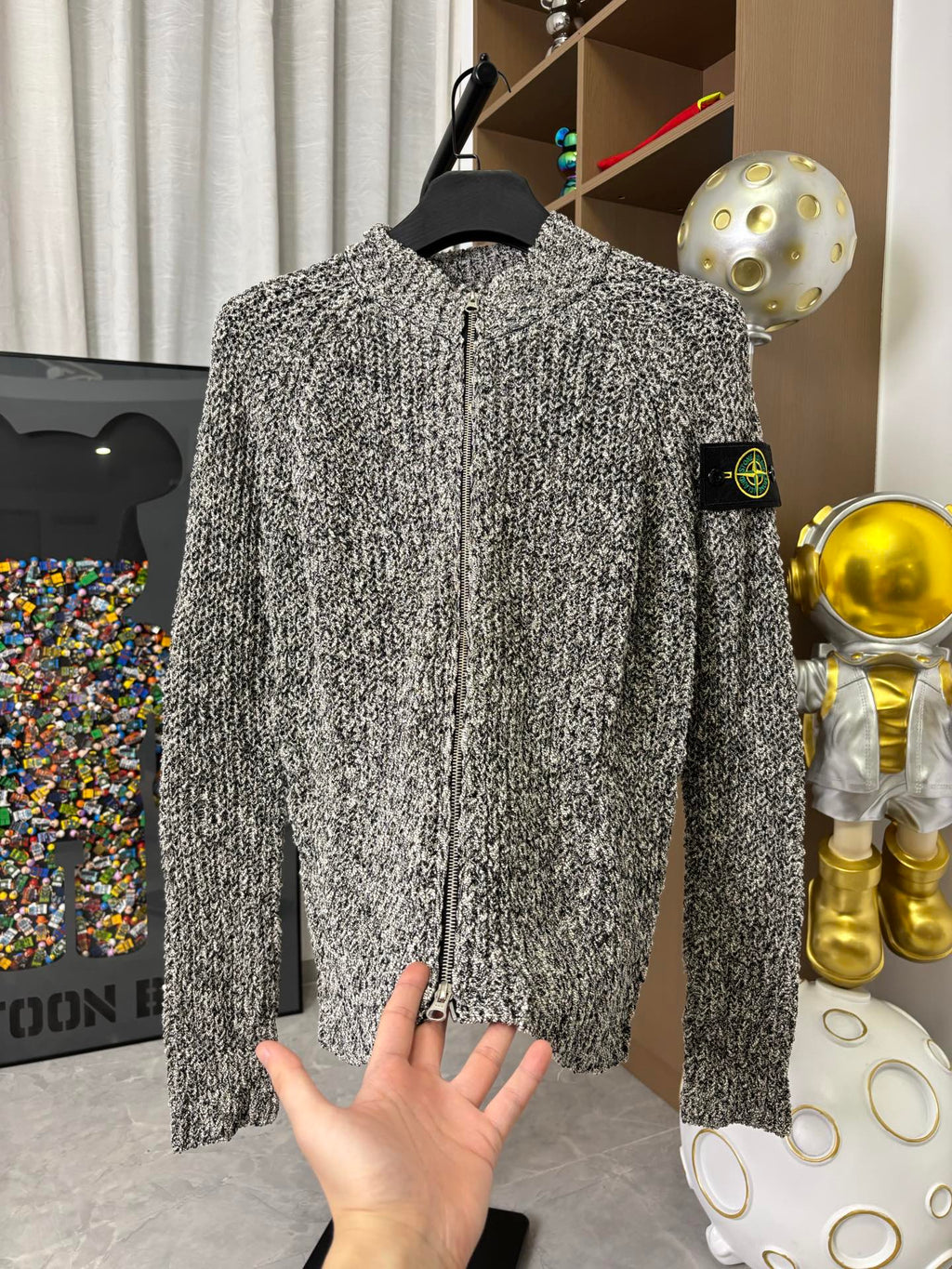 Textured black-and-white speckled zip jacket with stand collar, front zipper