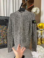 Textured black-and-white speckled zip jacket with stand collar, front zipper