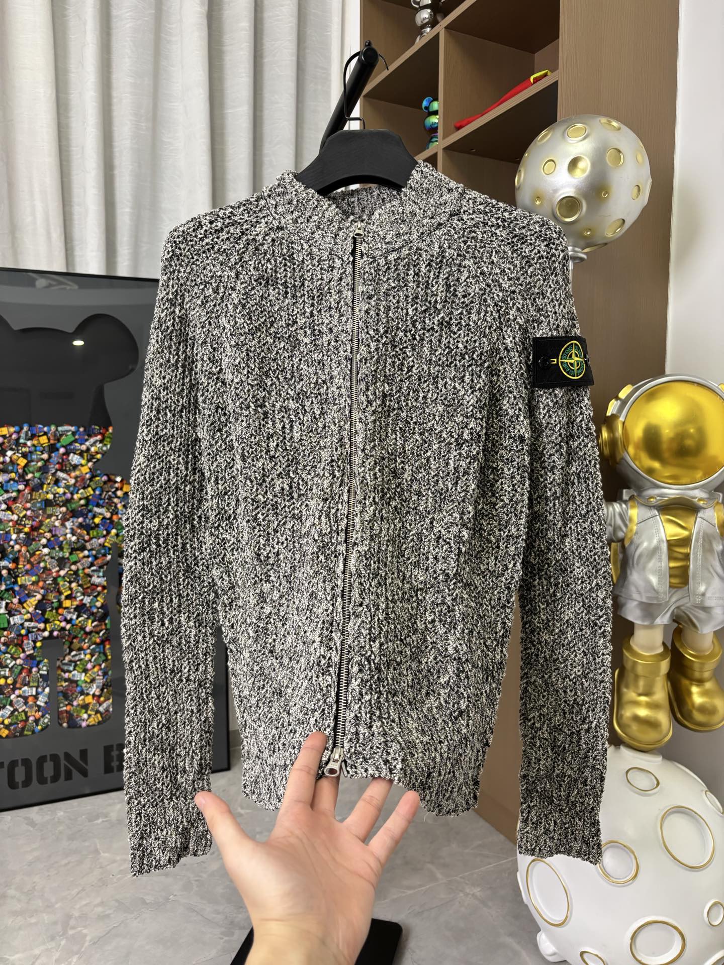 Textured black-and-white speckled zip jacket with stand collar, front zipper