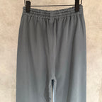 Balenciaga slate gray wide-leg pants close-up of elastic waistband and front slit