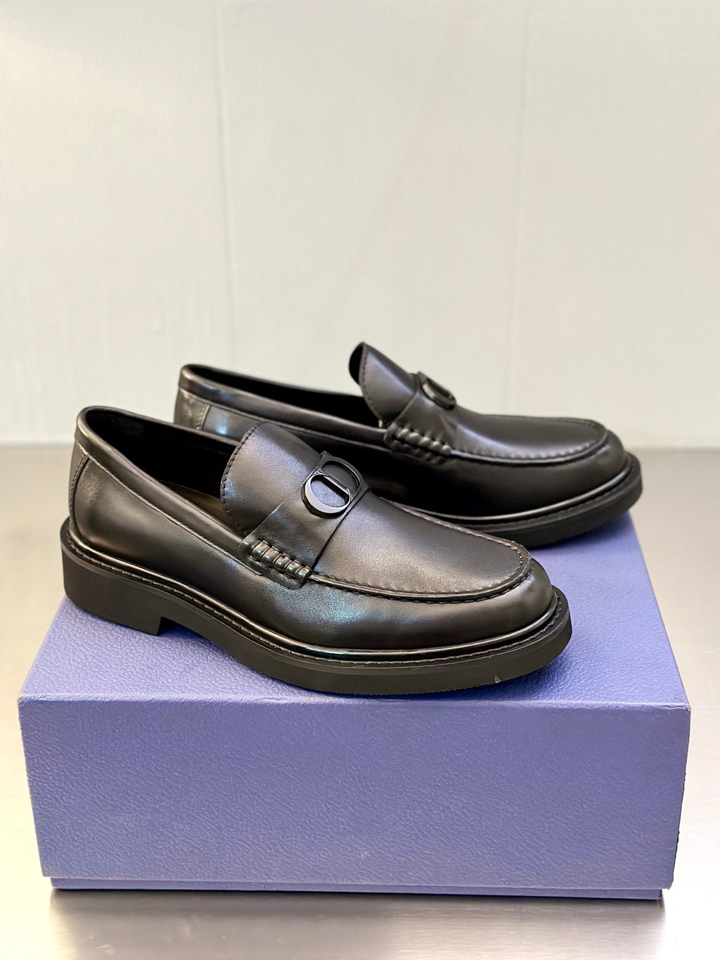 Dark leather Dior loafers with D buckle and stitched side detail, low platform sole