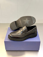 Dark leather Dior loafers with star-marked outsole and D buckle upper