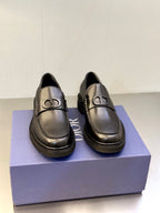 Dark leather Dior unisex loafers with gold-tone D buckle, rounded toe, platform sole