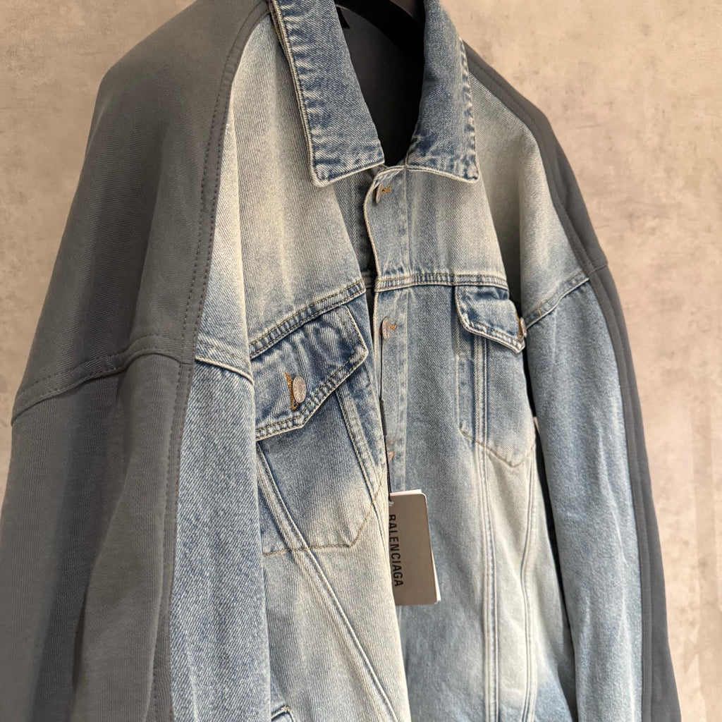 Charcoal and light-blue denim jacket with panel seams and patch pockets