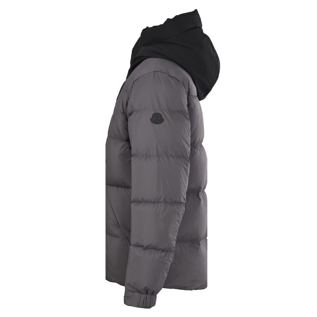 Dark gray long puffer jacket, side view with quilted padding and hood