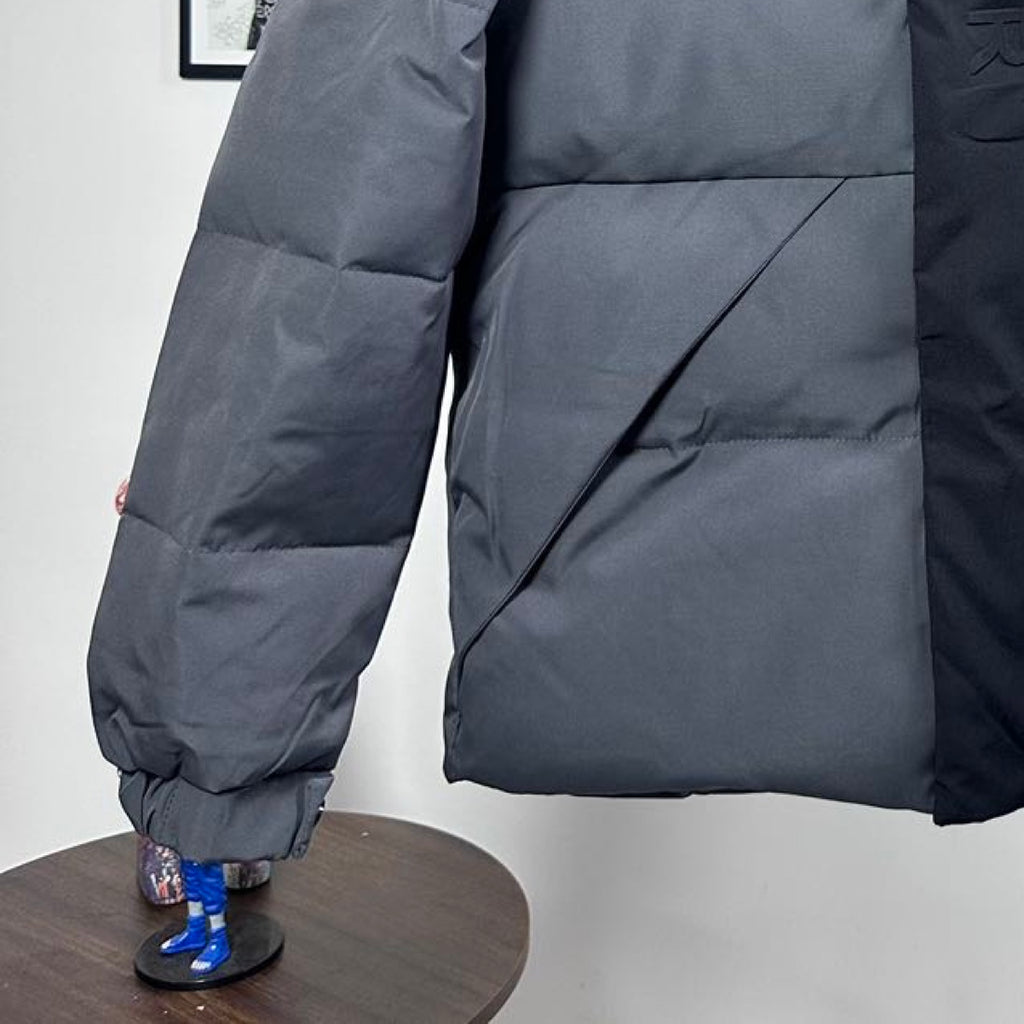 Moncler long puffer jacket lower front, dark gray, quilted panels with elastic cuff ends