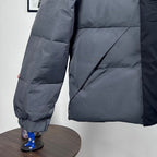Moncler long puffer jacket lower front, dark gray, quilted panels with elastic cuff ends