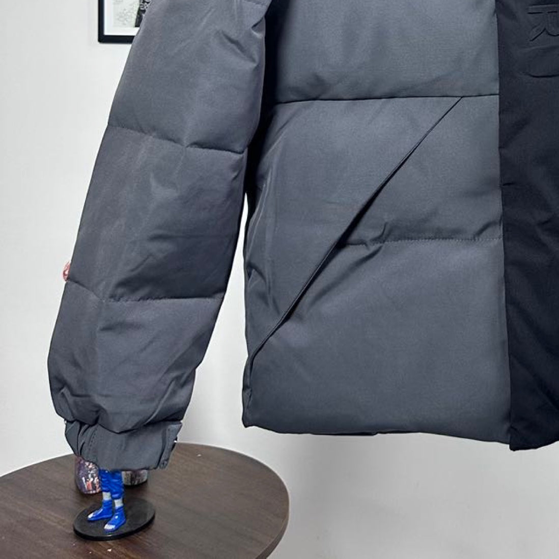 Moncler long puffer jacket lower front, dark gray, quilted panels with elastic cuff ends