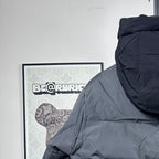 Moncler hooded puffer jacket upper back detail, dark gray with rounded hood shape