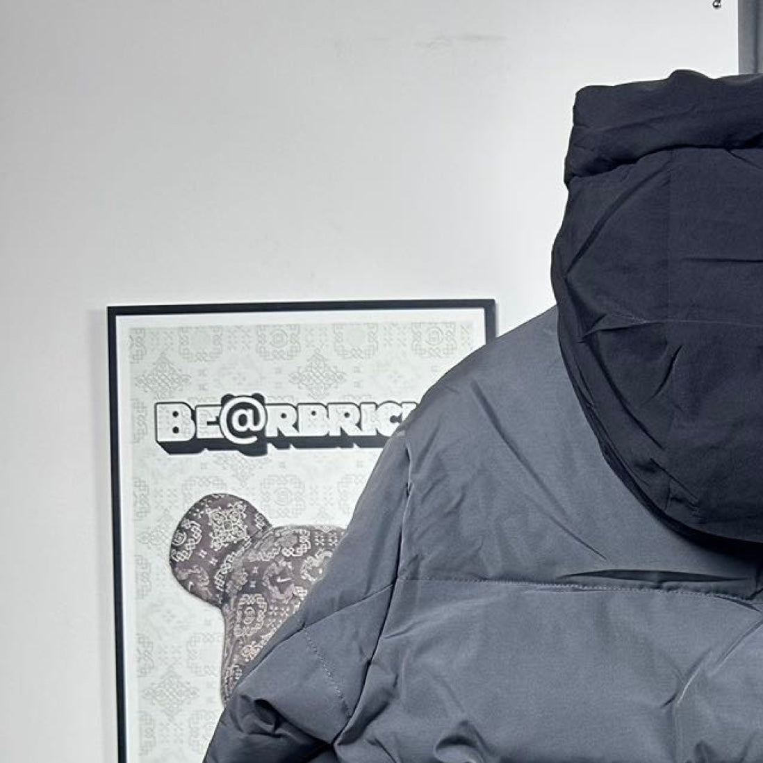 Moncler hooded puffer jacket upper back detail, dark gray with rounded hood shape