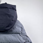Moncler long puffer jacket hood and upper back, dark gray, quilted construction