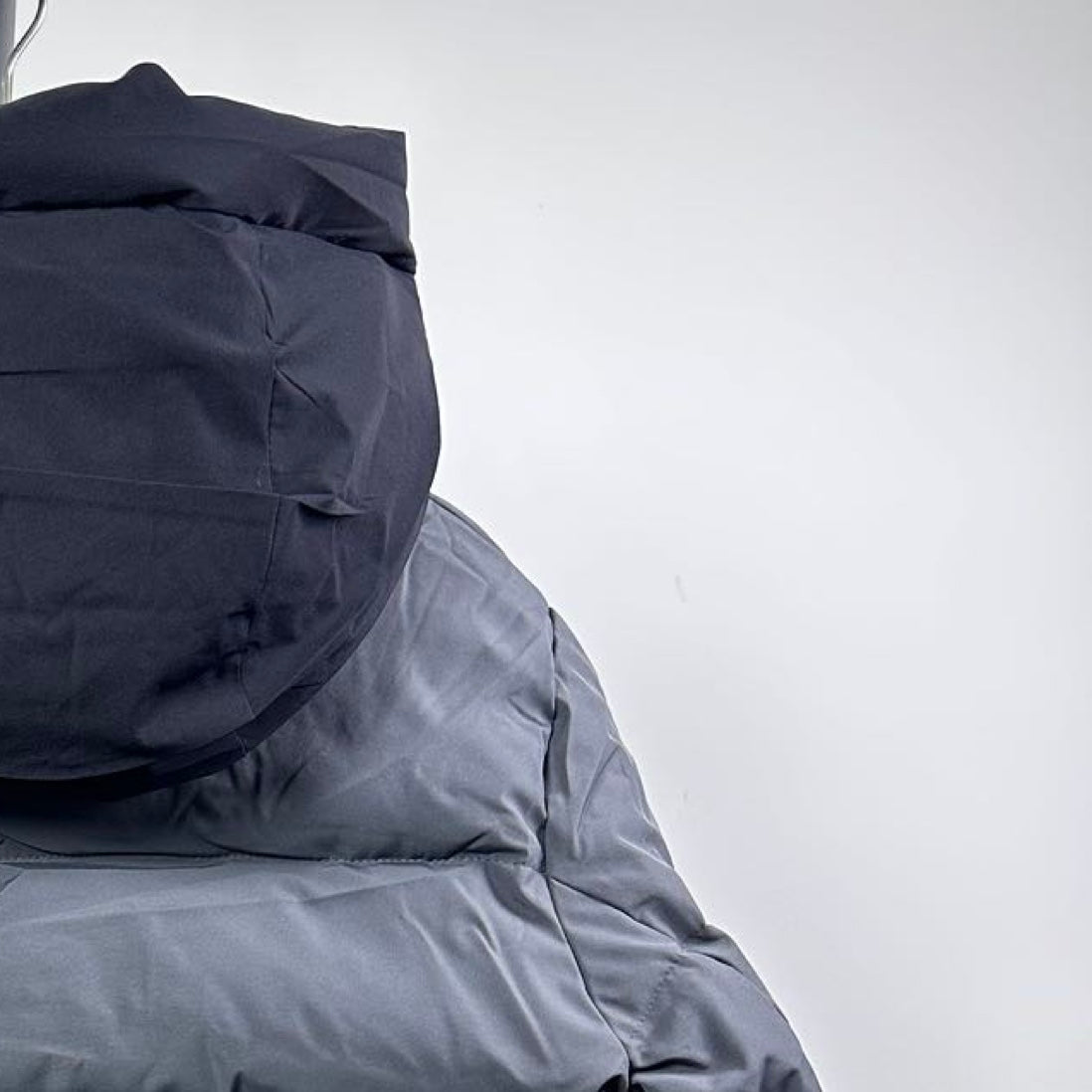 Moncler long puffer jacket hood and upper back, dark gray, quilted construction