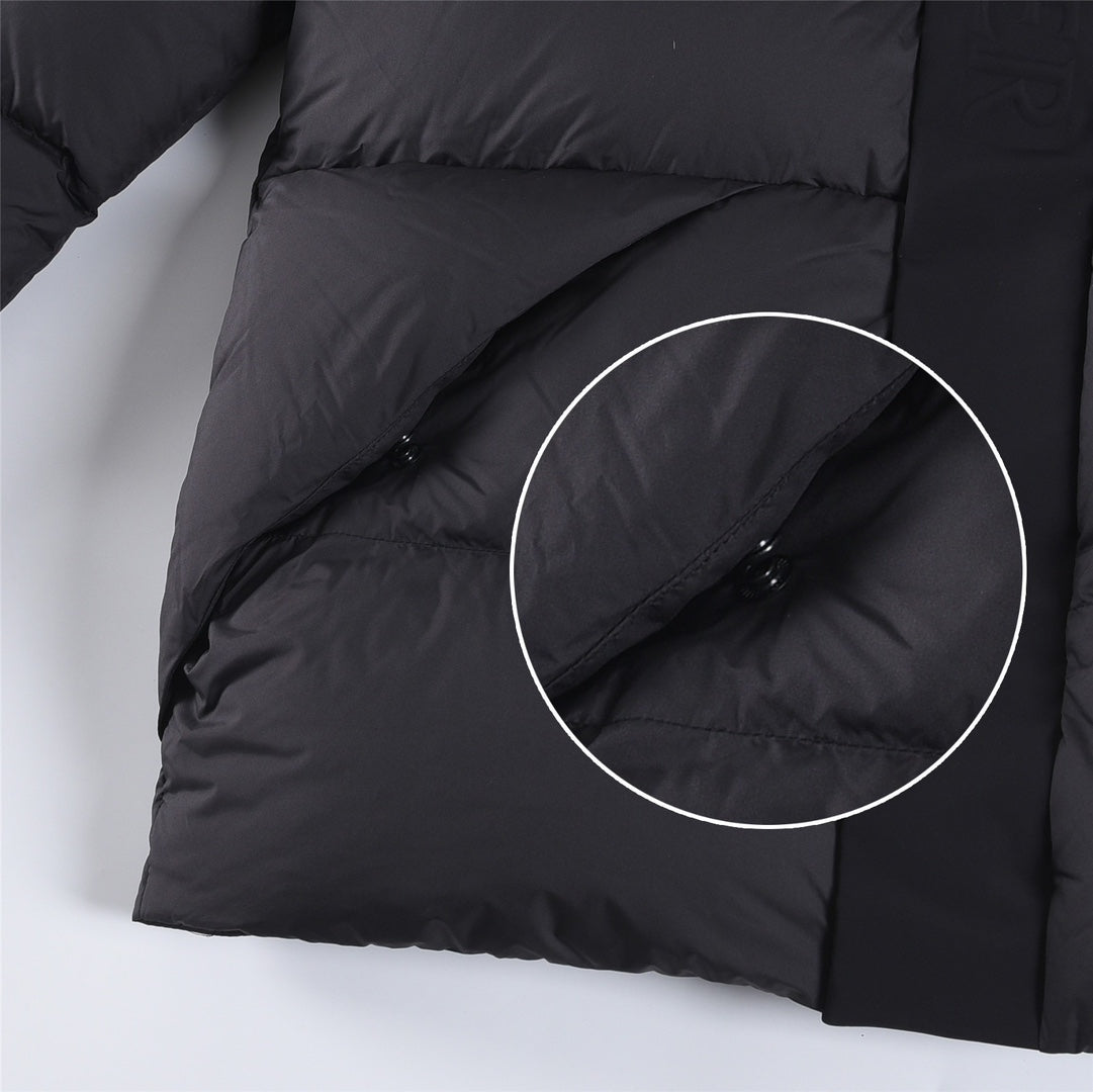 Puffer jacket hem with pocket flap and snap detail, dark color