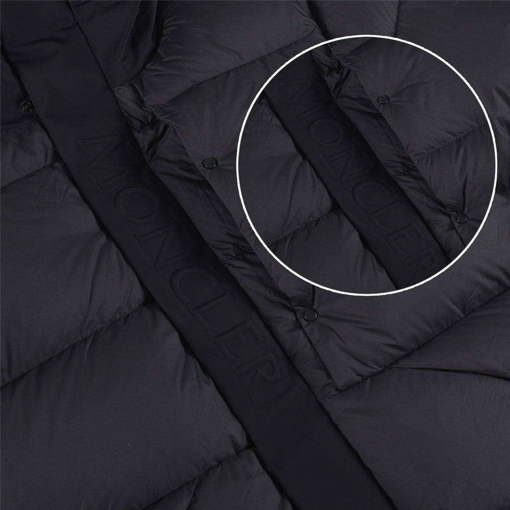 Quilted puffer jacket front detail with snap buttons, dark color