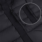 Quilted puffer jacket front detail with snap buttons, dark color