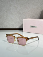 Square sunglasses with gold frame and pink tinted lenses, gold accents, slim temples