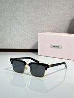 Square sunglasses with black frame, gold accents, dark tinted lenses, slim temples