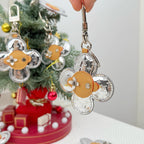 Louis Vuitton floral charm keyring hanging on hook with silver monogram flower