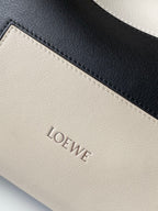 Loewe bag leather logo panel with dark trim in light gray tone