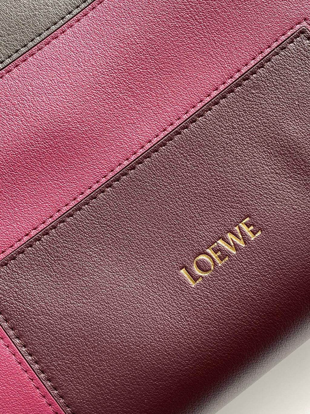 Loewe leather bag panel with pink inset and gold Loewe lettering
