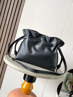 Loewe leather drawstring bucket bag in black with curved handle