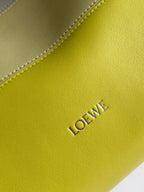 Lime leather panel with stitched edge and embossed "LOEWE" logo