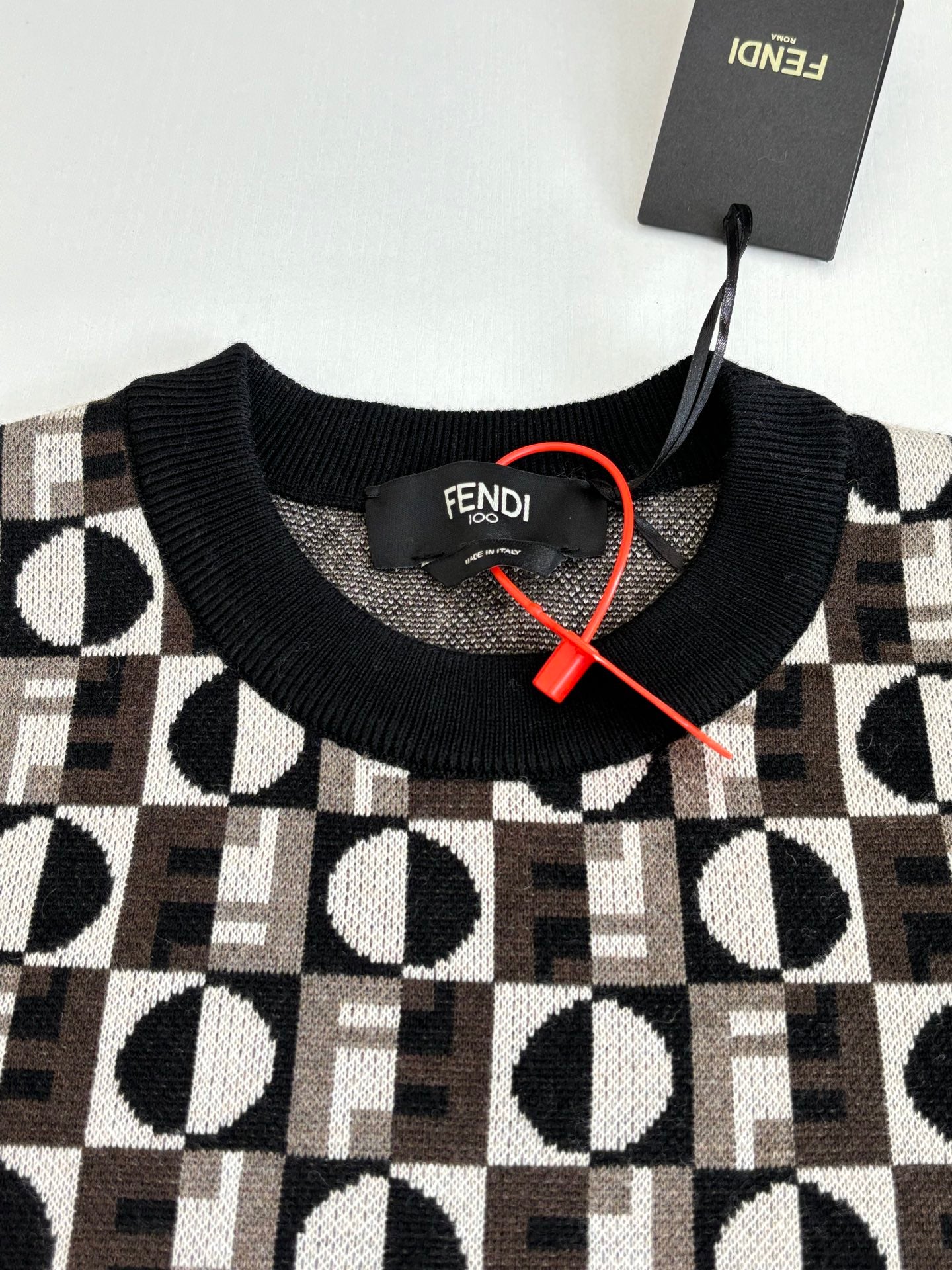 Knit sweater neckline with Fendi monogram check pattern and ribbed collar