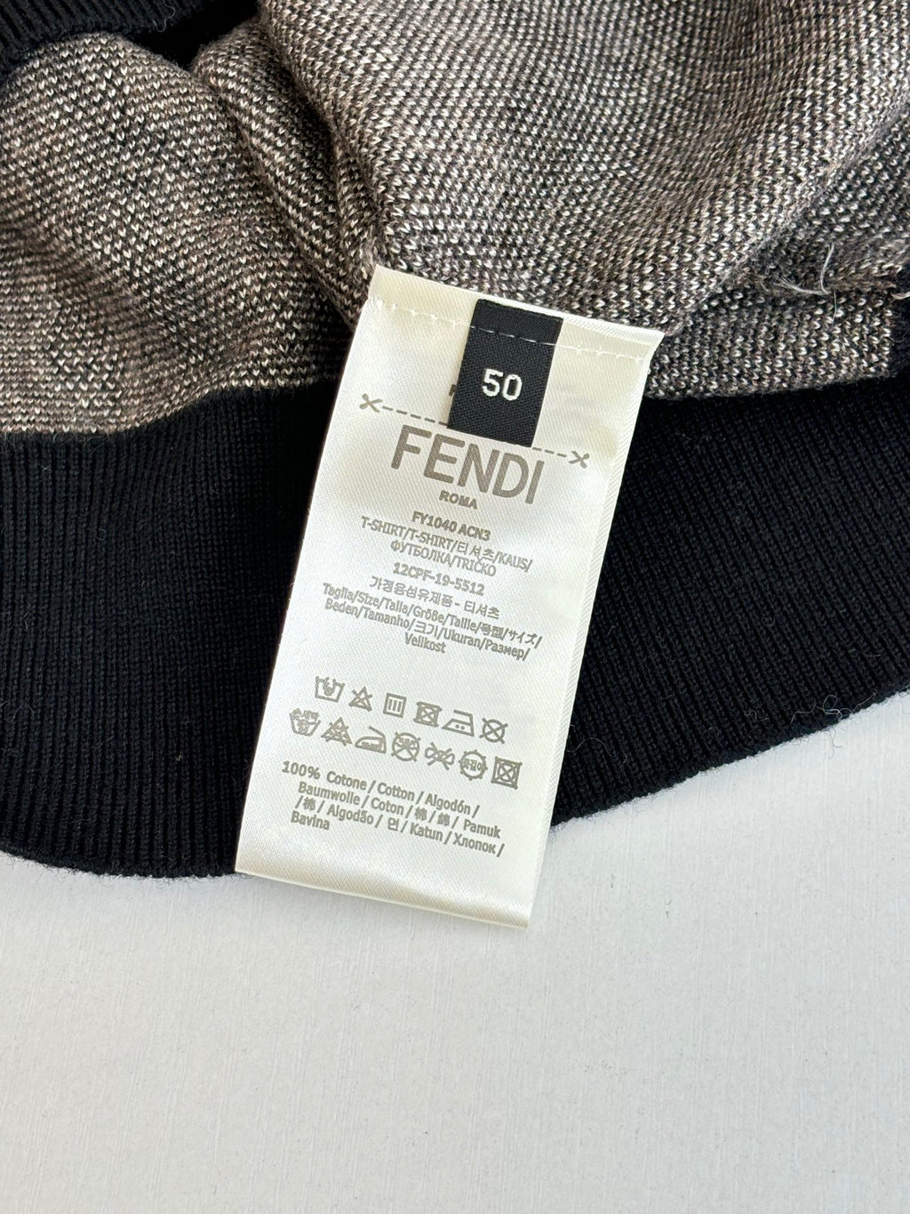 FENDI size 50 label with care icons on black ribbed knit collar