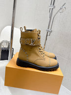 Tan lace-up ankle boot with front logo band and jeweled stud details