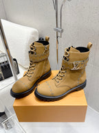 Tan lace-up ankle boots with studded panel detailing and black rubber sole