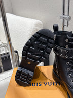 Black boot outsole and side view; studded boot with lug tread