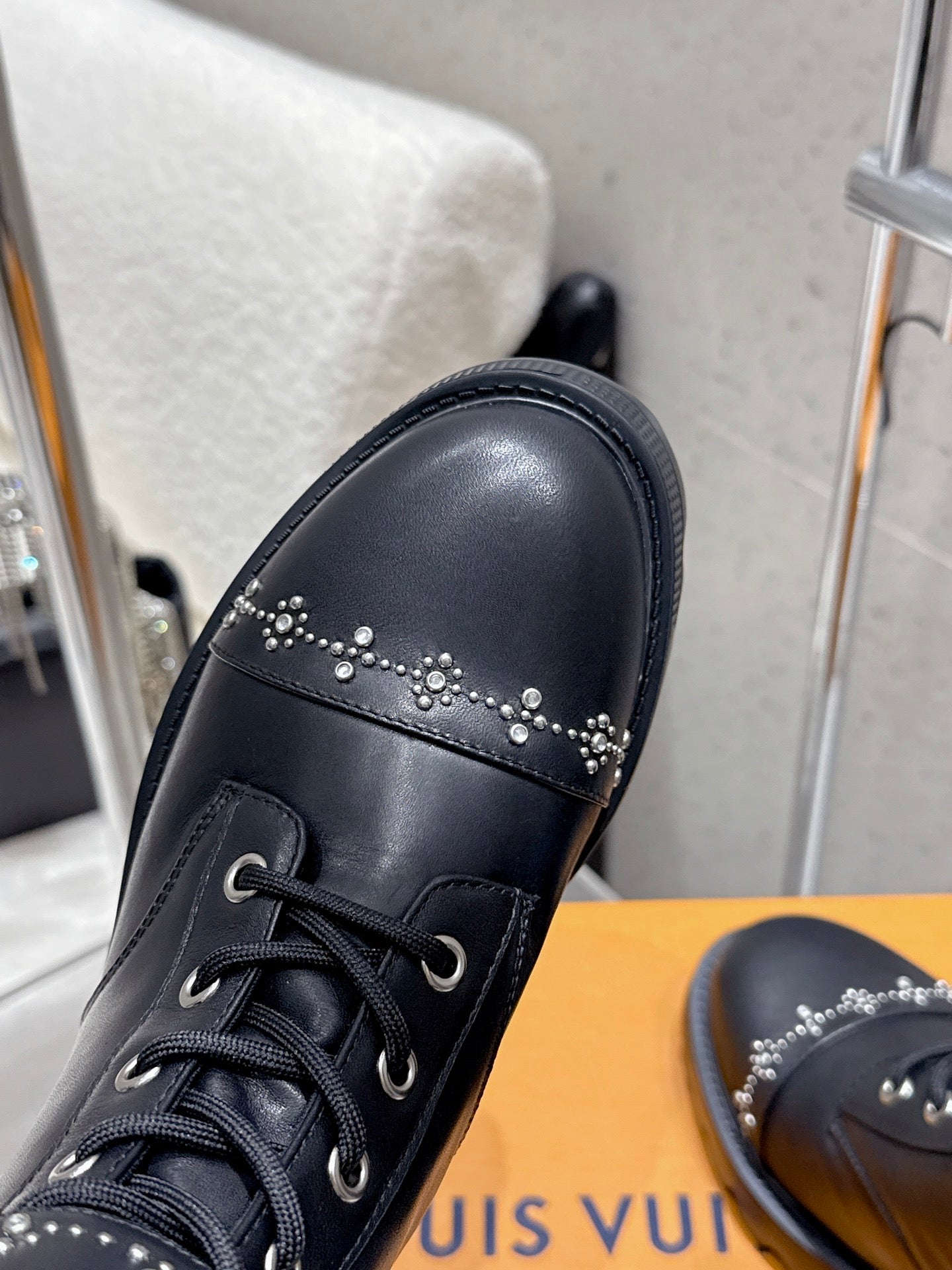 Black leather boot with black laces and small rhinestone stud detail