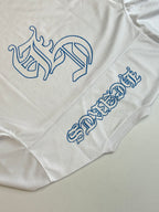 White long-sleeve jersey close-up with blue animal and lettering graphics