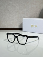 Black eyeglass frames with clear lenses and star detailing on temple