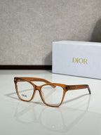 Amber brown eyeglass frames with clear lenses and logo on temple
