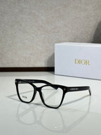 Matte black eyeglass frames with clear lenses and star detailing