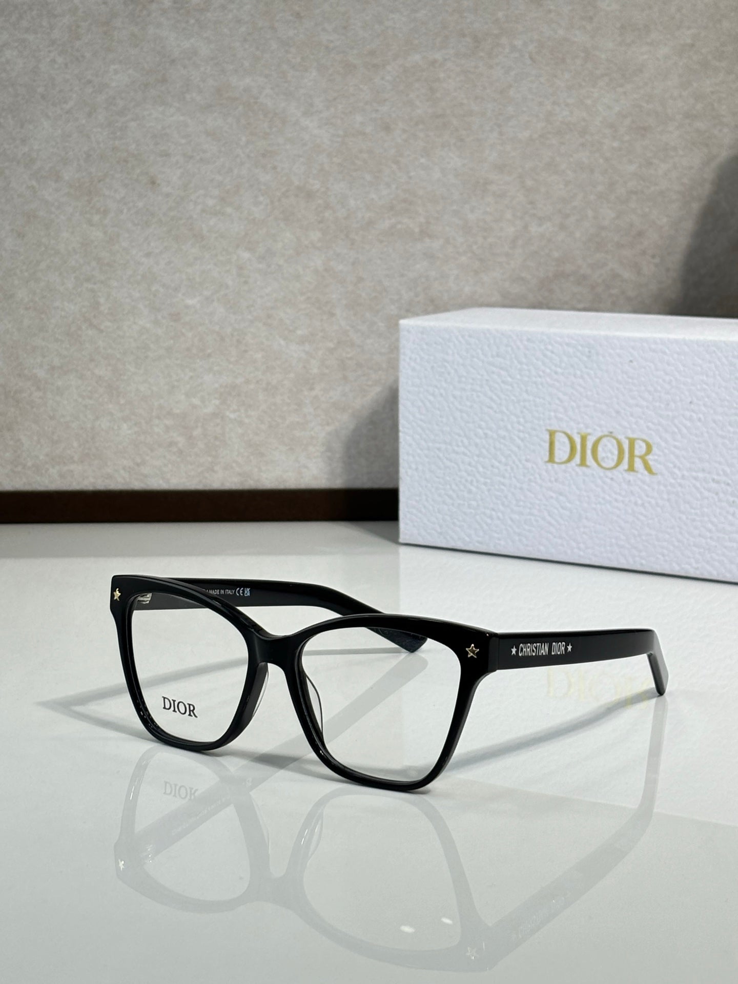 Matte black eyeglass frames with clear lenses and star detailing