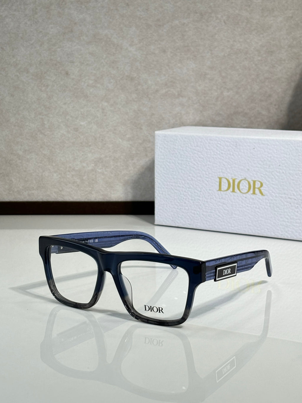 Dior rectangular eyeglasses with deep blue frames, angled front view