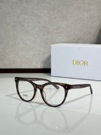 Brown tortoiseshell full-rim eyeglasses with round frames and clear lenses, Dior logo