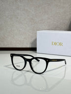 Black full-rim eyeglasses with round frames and clear lenses, Dior logo