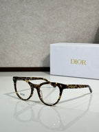 Dark tortoiseshell full-rim eyeglasses with round frames and clear lenses, Dior logo