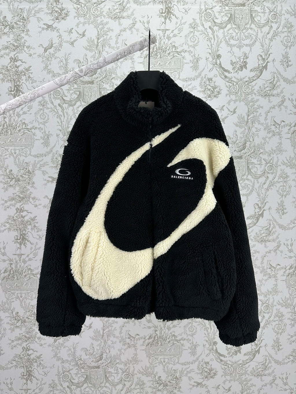 Black shearling-style jacket with off-white diagonal stripe and Balenciaga logo
