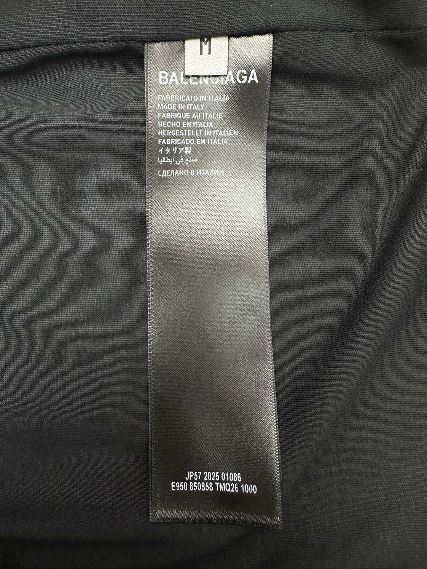 Balenciaga clothing size tag on black fabric
