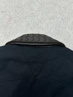 Dark jacket back yoke with quilted collar panel detail