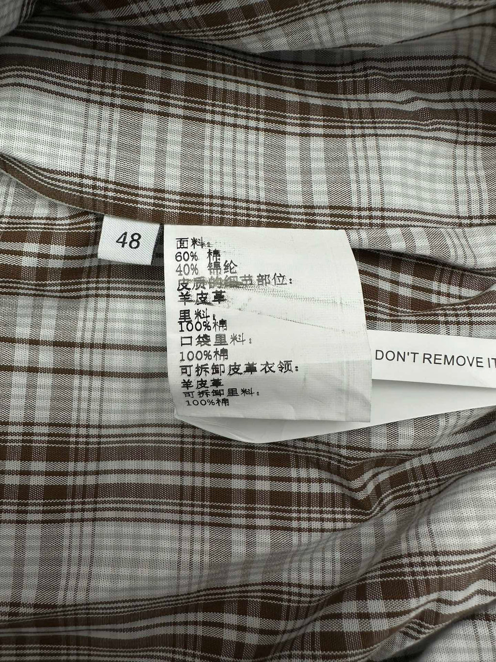 Garment size and fabric label with code 48 and care instructions