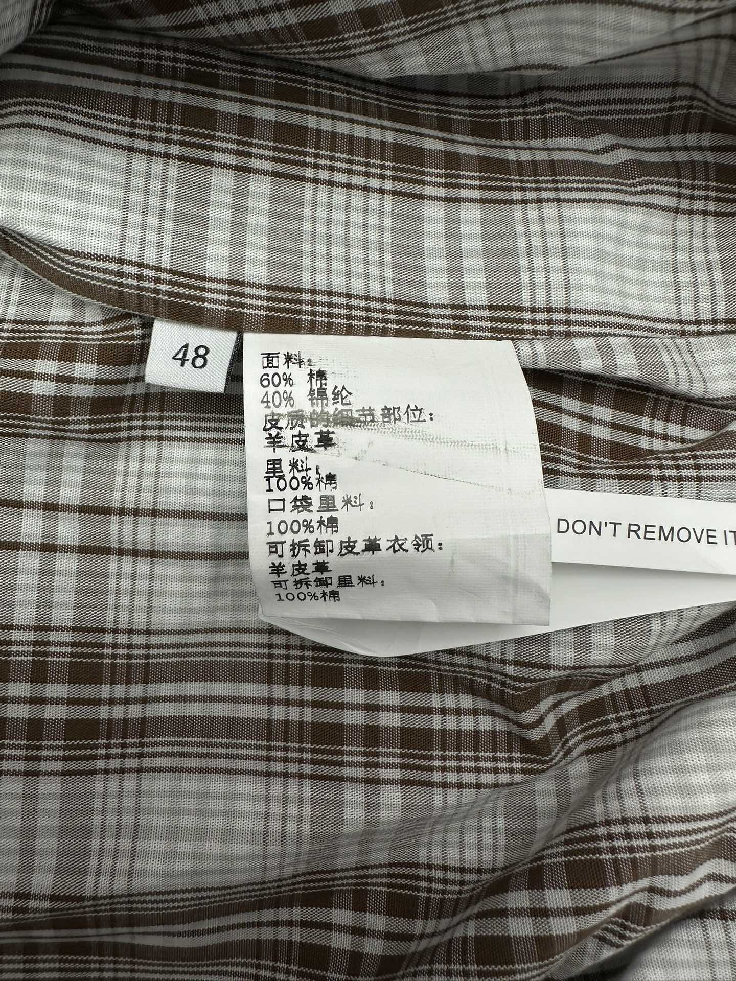 Garment size and fabric label with code 48 and care instructions